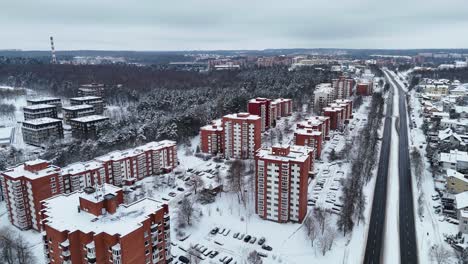 Residential-area,-high-rise-buildings-covered-in-snow-in-winter-after-snowfall