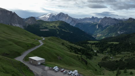 Aerial-view-flying-over-Canazei-valley-wilderness-towards-majestic-Italian-Dolomites-alpine-mountains