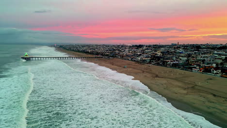 Aerial-view-along-the-coast-of-Manhattan-Beach,-colorful-dusk-in-Los-Angeles,-USA