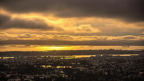 High-angle-shot-over-San-Francisco-skyline-in-California,-United-States-with-dark-rain-clouds-passing-by-during-evening-time