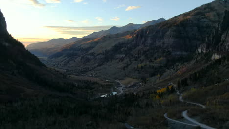 Telluride-Colorado-aerial-drone-4wd-off-roading-historic-town-scenic-landscape-autumn-golden-yellow-Aspen-trees-sunset-Rocky-Mountains-Silverton-Ouray-Millon-Dollar-Highway-slowly-forward-reveal-up