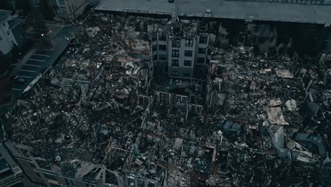 Aerial-top-view-of-destroyed-home-in-american-neighborhood-after-fire