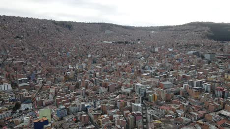 Aerial-adventure:-Plaza-Murillo,-La-Paz-skyline-unfolds-as-the-drone-gracefully-moves-forward