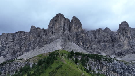 Dolomites-mountain-range-slow-looking-up-to-cloudy-overcast-Italian-summit-peaks