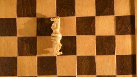 Defeated-white-knights-knocked-down-on-a-chessboard