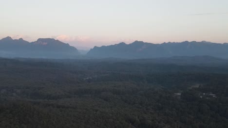 Aerial-View-Of-Morning-Fog-Over-Tropical-Forest-In-Chiang-Dao