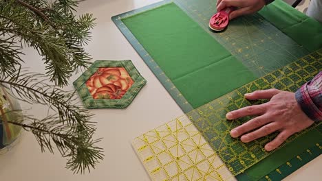 Patchwork-quilt-creation-process---cutting-of-the-fabric-into-blocks