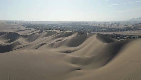 Drone-glides-gently-forward,-immersing-in-the-mesmerizing-details-of-Ica's-dunes