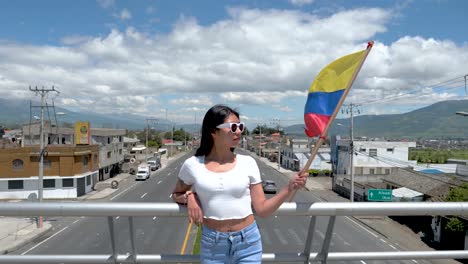 Waving-flag-of-Ecuador-over-empty-highway,-South-America-woman-patriotic
