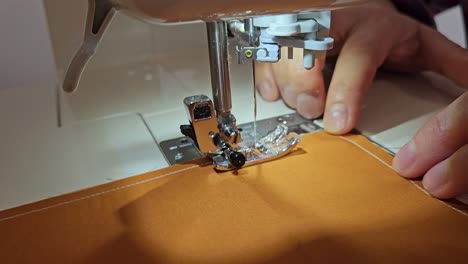 Patchwork-quilt-creation-process---close-up-of-the-sewing-machine-during-sewing