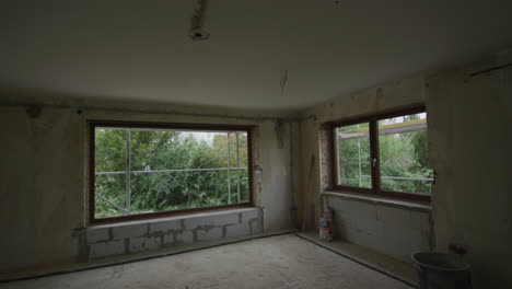 Wide-tracking-shot-of-living-room-which-gets-renovated,-new-installation,-new-windows