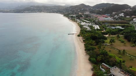 Tropical-sandy-beach-in-Caribbean-sea,-aerial-of-Grand-Anse-Beach