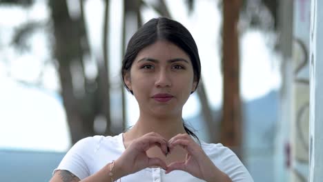 Peace-love-sign-Up-close-by-Latin-America-woman,-unity-no-war-news-in-Ecuador