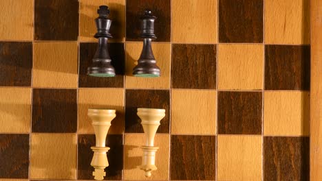 King-and-queen-from-chess-set-lost-the-game,-bad-and-good-team-opponents