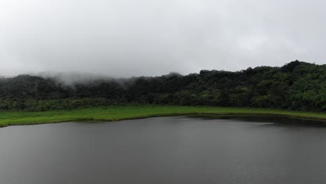 Panacross-volcanic-crater-lake-in-Grand-Etang-National-park-as-clouds-descend-trees