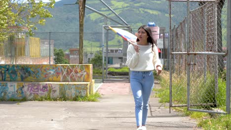 Hopeful-patriotic-Latin-America-woman-outside-waving-flag-from-Ecuador