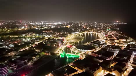 Panoramic-aerial-overview-of-Willemstad-Curacao-evening-with-night-glows