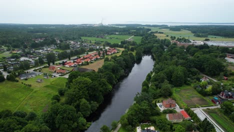 Aerial-View-of-Morruman-River-Running-Through-Swedish-Village-Morrum
