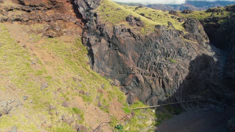 Aerial-of-green-mountain-landscape-by-Manawainui-Gulch-on-Maui,-Hawaii