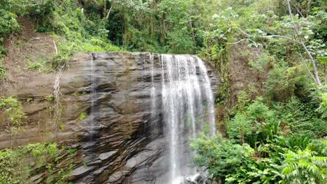 Tropical-waterfalls-aerial-push-out,-Carmel-Falls-in-Grenada