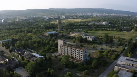 Aerial-reveal-shot-of-closed-chemical-factory-complex-in-Bratislava,-Slovakia
