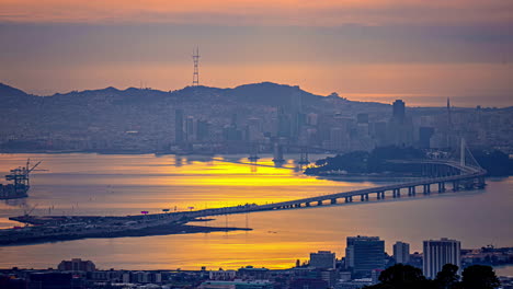 Sunrise-over-San-Francisco-and-the-Oakland-Bay-Bridge,-view-from-Grizzly-Peak