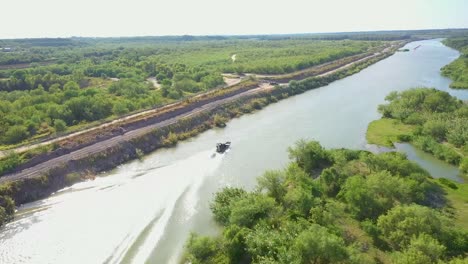 Border-Patrol-as-they-patrol-the-Rio-Grande,-the-border-between-Mexico-and-the-USA,-utilizing-a-hovercraft