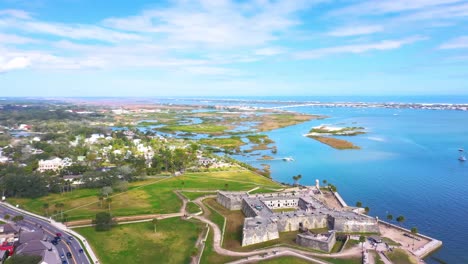 4k,-360-Aerial-video-circling-Castillo-de-San-Marcos-National-Monument-,-showing-Downtown-St