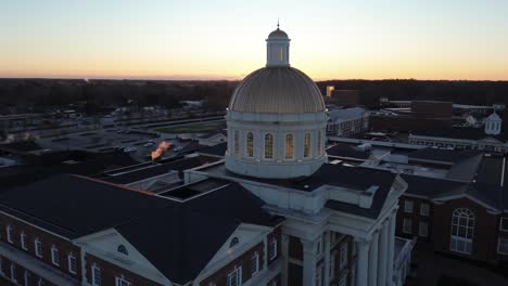 Christopher-Newport-Hall-with-dome-on-university-campus-at-sunset