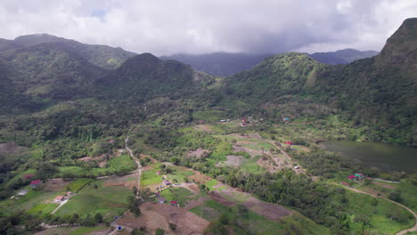 The-lush-green-san-carlos-region-with-a-volcanic-crater-lake,-roads,-and-scattered-houses,-partly-cloudy,-aerial-view