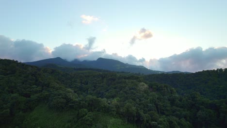 Glowing-sky,-mountains-and-jungle-of-Guadeloupe,-aerial-view