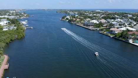 Drone-shot-looking-North-from-the-drawbridge-over-the-Intercoastal-Waterway-in-Boynton-Beach-Florida-with-pleasure-boat-in-the-distance