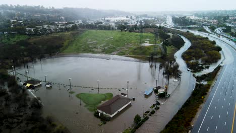 Panoramic-aerial-orbit-around-flooded-community-park-in-San-Diego-California