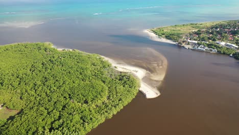 Drone-view-of-the-River-Santo-Antônio-flowing-into-the-beach-of-the-same-name