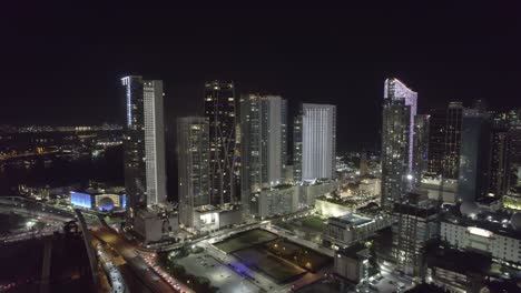 drone-vide-of-Miami-skyline-at-night-overlooking-luxury-condominiums-and-new-construction-projects