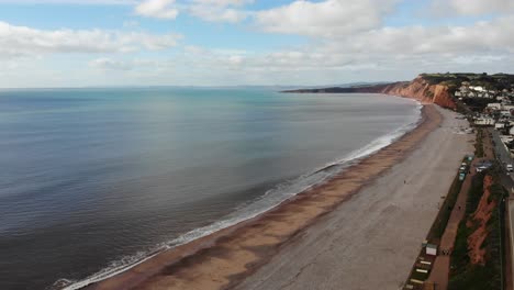 Aerial-View-Of-Budleigh-Salterton-Beach-With-Calm-English-Channel-Waves