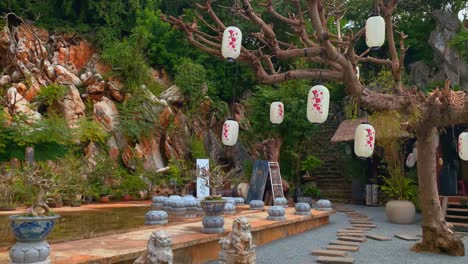 Traditional-Asian-Zen-Garden-with-Hanging-Lanterns-and-Peaceful-Setting