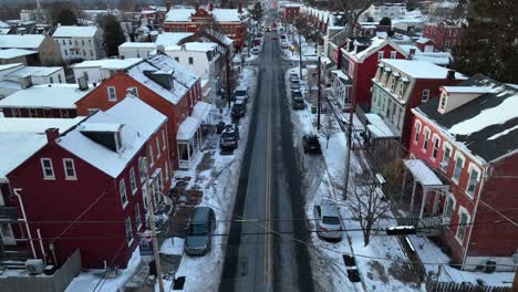 Icy-Road-in-american-town-with-snow-covered-roofs