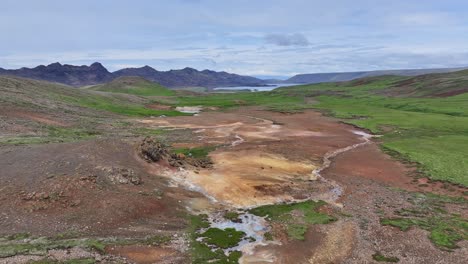 An-aerial-drone's-forward-view-from-Engjahver's-steam-lake-to-the-nearby-Kleifarvatn-Lake-on-the-Reykjanes-Peninsula-in-Iceland