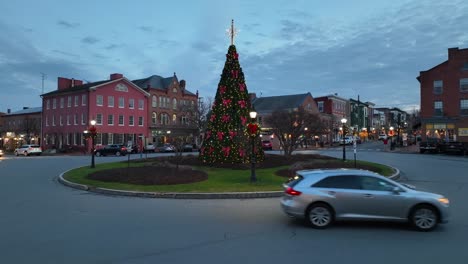 Aerial-shot-of-a-tall-Christmas-tree-in-an-American-town-center