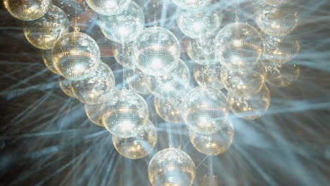 Dynamic-laser-light-show-by-projecting-lights-onto-hazy-mirror-balls
