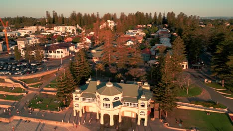 Aerial-over-Cottesloe-Town-Revealing-the-Beach-and-Indiana-Teahouse-at-Sunset,-Perth,-Australia