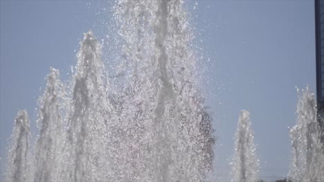 Powerful-jet-plumes-make-sparkling-cascading-display-in-water-fountain-SLOW-TILT-UP