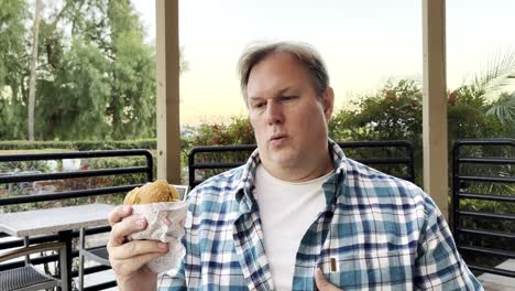 Man-gets-heartburn-trying-to-eat-burger
