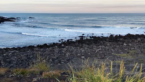 Seascape-waves-flowing-onto-Vik-rugged-Iceland-rocky-coastal-shoreline