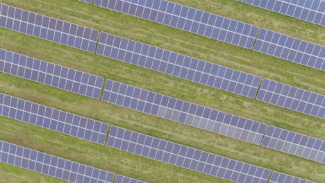 Abstract-green-energy-photovoltaic-solar-panels-top-down-spinning-aerial