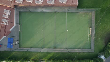 aerial-footage-over-empty-football-pitch,-Mallorca,-Spain