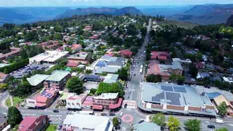 Aerial-drone-of-Katoomba-main-town-commercial-shops-housing-residential-street-landscape-roads-Blue-Mountains-Australia