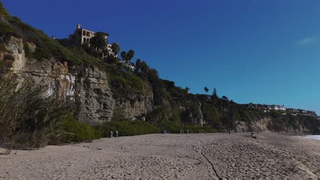 Lush-Cliffside-with-Empty-Beach-and-Volleyball-Net