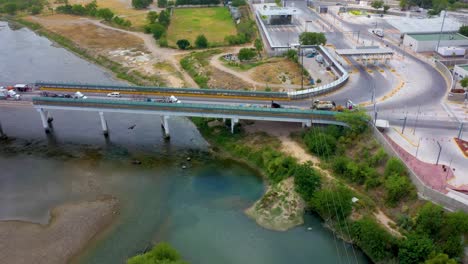 aerial-footage-of-the-International-Bridge-connecting-Acuña,-Mexico,-and-Del-Rio,-Texas